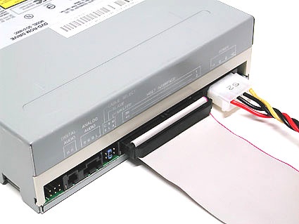 Connecting to a DVD drive: the red stripe on the ribbon cable should always be next to the power cable (to the right of the white peripheral connector in this photo)