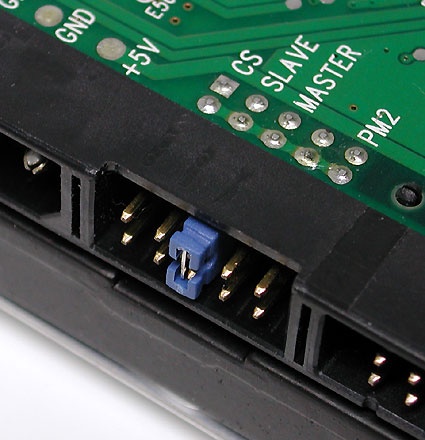 One ribbon cable can handle two devices, such as a combination of two hard disks or a hard disk and a DVD player or burner. When two devices share a ribbon cable, one must always be configured as the master, and the other as a slave. This configuration usually requires setting a jumper as shown in this picture. A single jumper usually handles this setting on most modern drives; if in doubt about placement, please consult the device documentation (or the vendor's website).