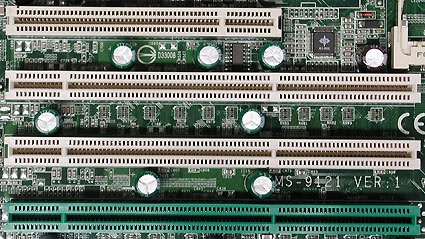 A classic 32-bit PCI slot above, with three 64-bit PCI-X slots below. The green slot offers ZCR (Zero Channel RAID) support.